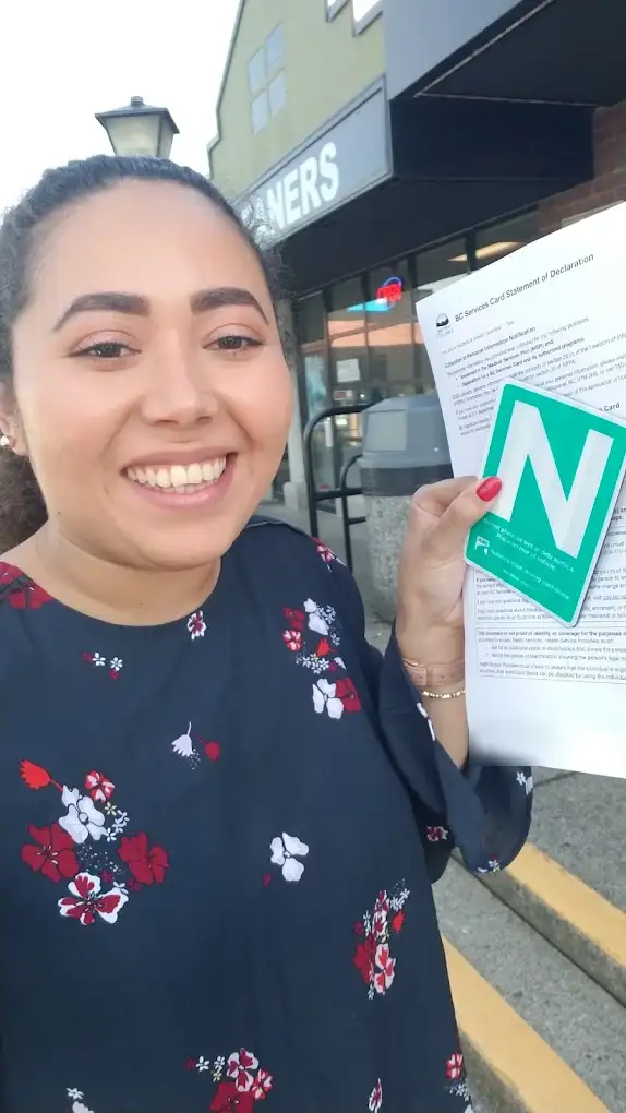 A Dasmesh student holding her new N sign